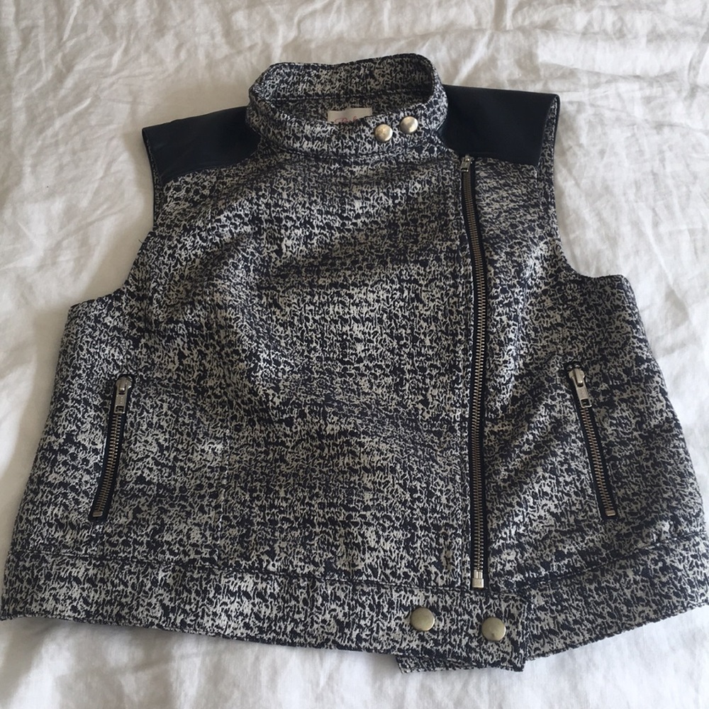 Navy trimmed white and navy vest.